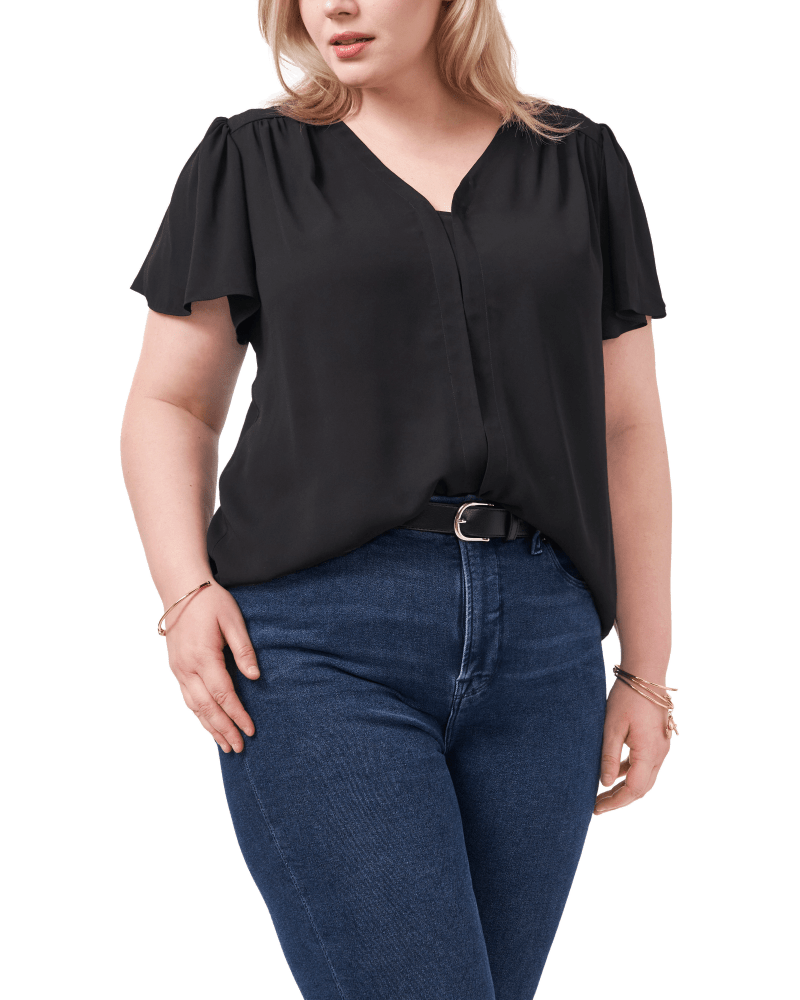 Front of a model wearing a size 1X Lily Flutter Sleeve Blouse in RICH BLACK by Vince Camuto. | dia_product_style_image_id:261180